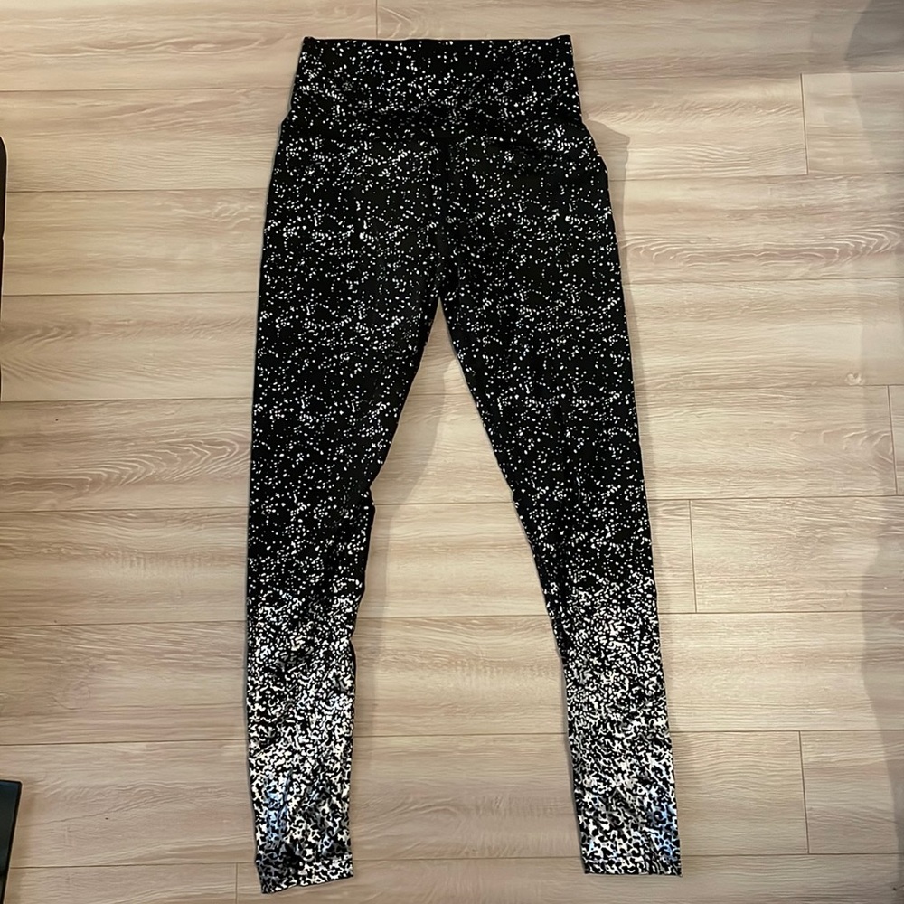 Black and silver metallic leggings. SHEIN